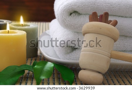 Towel, aromatic candles and other spa objects to make mood relax