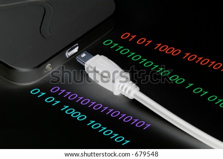Mini usb plug, external hard disk drive and colored binary numbers