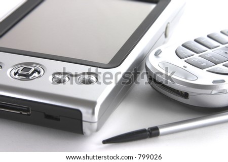 Pocket PC and mobile phone isolated over white background