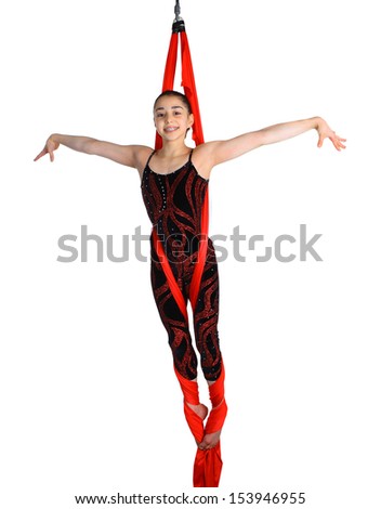 acrobatic gymnastic girl exercising on red fabric rope, isolated on white background
