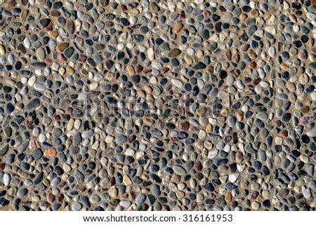 The texture of the road is lined with fine sea pebbles