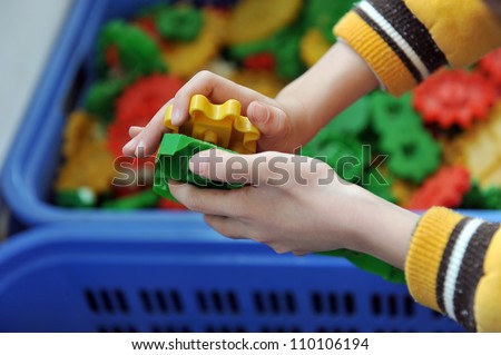 boy\'s hands keeping slice puzzle try its collect.