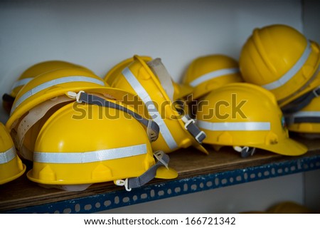Some yellow construction helmets on work place.