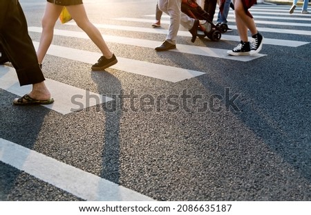 Similar – Foto Bild auf dem Zebrastreifen auf der Straße gehen.