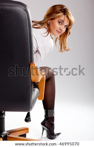 Female manager pauses in the work of sitting in a chair