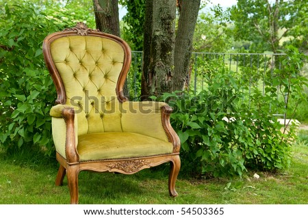 Antique armchair in green