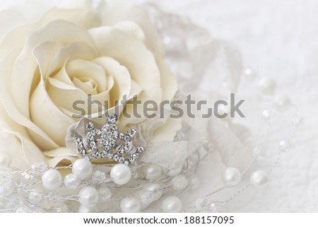 Cream color rose with small jeweled crown