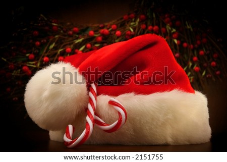 Santa\'s hat on a fireplace mantel
