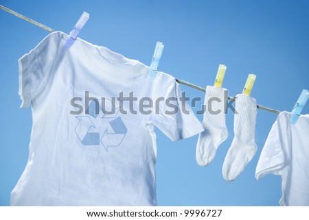 Eco- friendly  laundry drying on clothes line against a blue sky