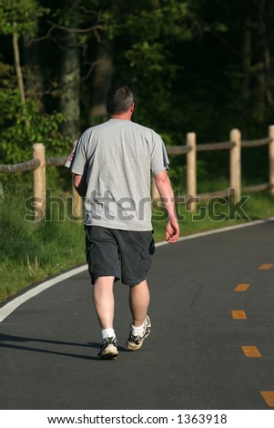 man walking on path