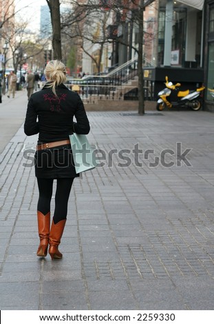 http://image.shutterstock.com/display_pic_with_logo/54510/54510,1165024435,17/stock-photo-stylish-woman-walking-down-street-2259330.jpg