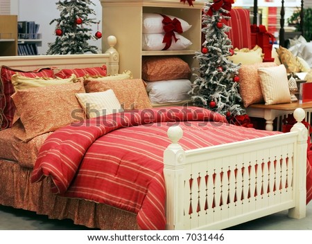beautiful bed with autumn colored linens and holiday decorations