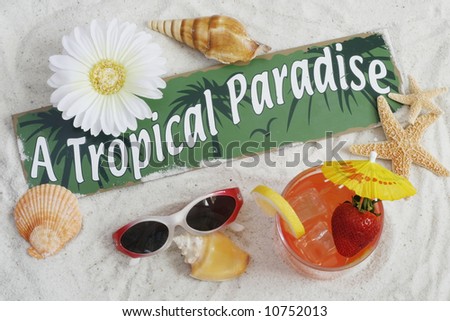 tropical drink, seashells, sunglasses and sign saying 