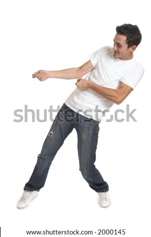 Funny Young Man Over White Background / Pulling Something Stock Photo ...