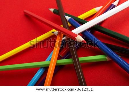 A Stack of Colored Pencils on Red Background - check my gallery for more pictures