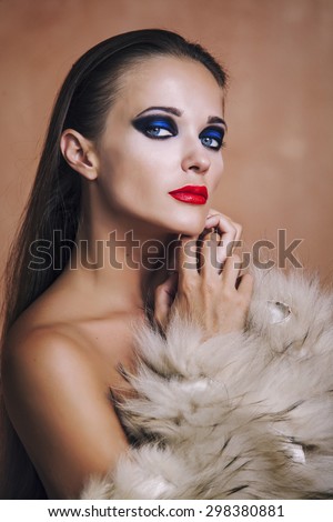 Beauty Fashion Model Girl in in a fur coat and lingerie. Beautiful Luxury Winter Woman