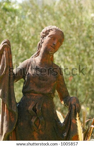 Weathered Statue of Woman