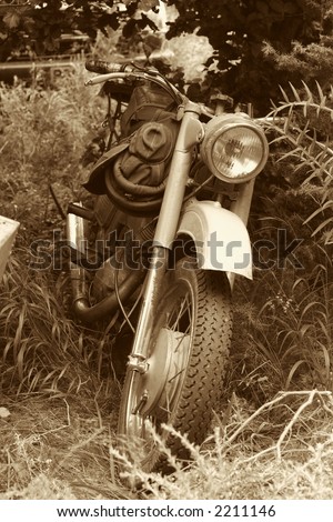 classic old motorcycle in parked in countryside