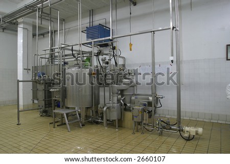 stainless steel temperature controlled tanks and pipes in modern dairy