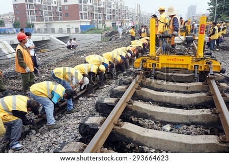 Anhui Huaibei China, June 20, 2015. Railway workers laid the railway. By 2015, China\'s railway mileage will reach 120000 kilometers or more.