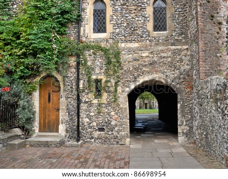 Wooden doorway and arched walkway in the Precincts of Canterbury cathedral