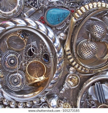 variety of gold and silver jewels, precious background