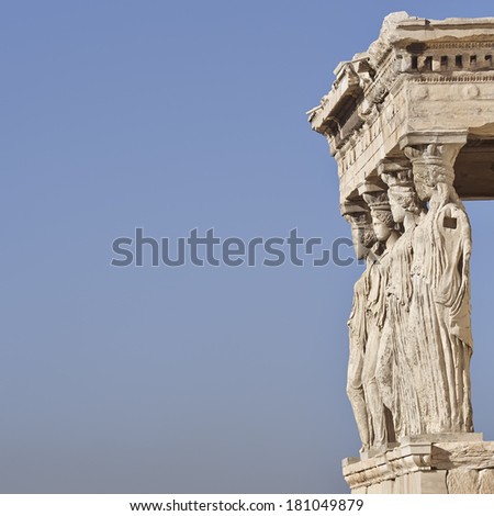 Caryatids ancient Greek statues, and blue sky as space for text