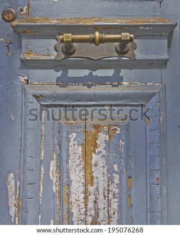 house entrance, old worn door and bronze handle detail