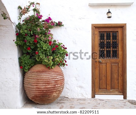 house door and huge flower jar, Greece