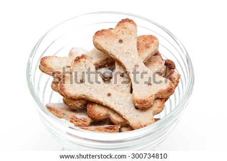 Home made dog biscuit in bowl Isolated on White Background