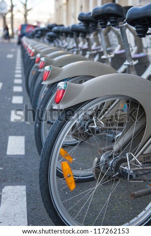 PARIS, FRANCE - JANUARY 6, 2012: Velib bicycles in the row on January 6, 2012 in Paris, France. Velib is a large-scale public bicycle sharing system in Paris, France.