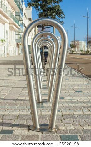 Metal bicycle rack on street in France