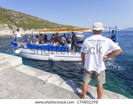 VIS, CROATIA - AUGUST 20, 2012: Tourist boat heading for the Blue cave, famous tourist attraction.