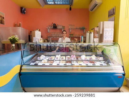 DUBROVNIK, CROATIA - MAY 26, 2014: Young waitress in Dolce vita, popular ice cream and cake shop.