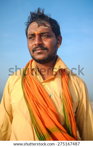 KAMALAPURAM, INDIA - 03 FEBRUARY: Indian pilgrim with scarf in a lungi and painted forehead on hilltop