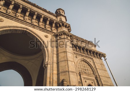 The Gateway of India, a monument built during the British Raj in Mumbai. Post-processed with grain, texture and colour effect.
