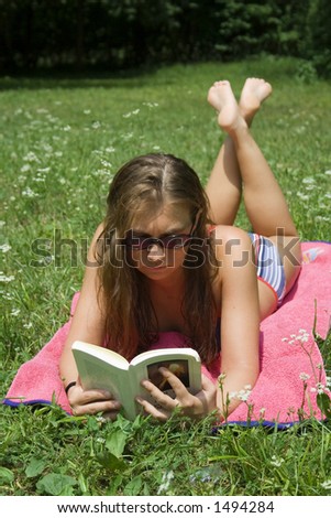 lady reading book in park