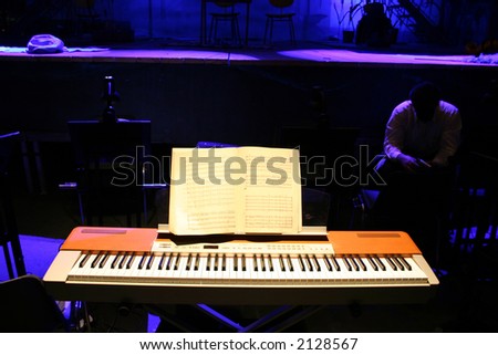 piano light in front of a stage before an opera