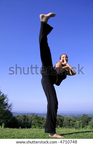 High Split Kick - Attractive Young Woman Practicing Self Defense Stock ...