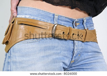 woman wearing leather belt bag with jeans