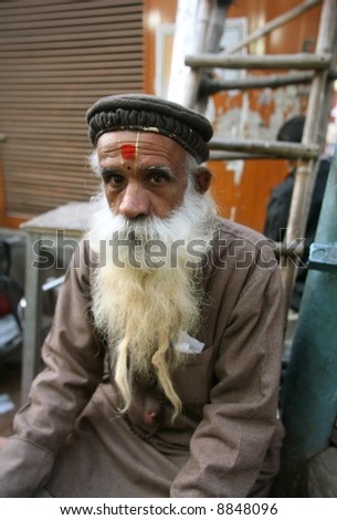 old bearded man at market, delhi, india