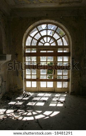 Door window entrance in an abandoned hotel after the war in Croatia