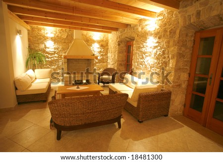 Luxury stone villa interior illuminated at night