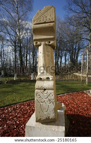 Hand sculpted stone sculpture of tribal face. Artist - James Roy Prescott.