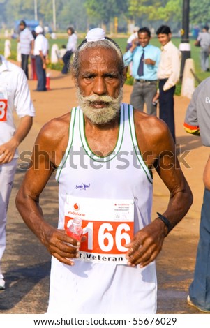 DELHI - OCTOBER 28: Elderly bearded Sikh man competing in marathon on October 28th, 2007 in Delhi, India. The 2009 event attracted around 29,000 runners.