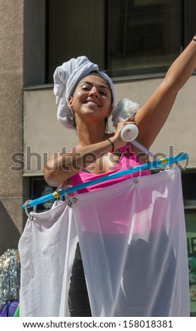 OTTAWA, CANADA - AUGUST 26: A woman pretending to bathe in the Capital Pride Parade on August 26, 2012 in Ottawa, Ontario.