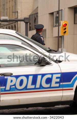 Policeman and police vehicles in downtown Ottawa, Ontario. Canada.