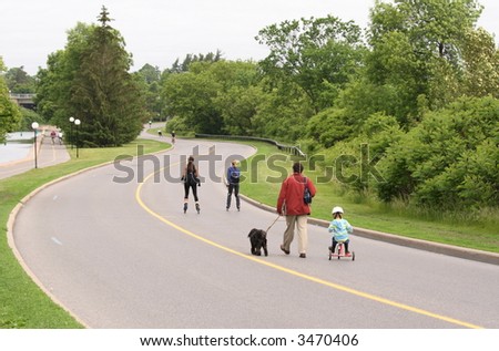 People enjoying parkway closed to traffic on Sunday mornings. Ottawa, Ontario. Canada.