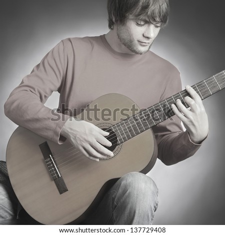 Acoustic guitar guitarist playing. Man player with classical musical instrument