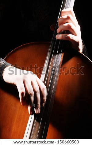 Cello playing cellist hands details. Orchestra musical instruments
